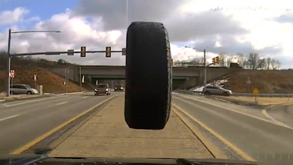 runaway tire hitting a car